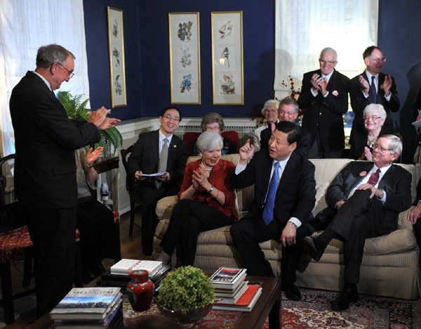File photo taken in February 2012 shows Xi Jinping (2nd R, front) and his old American friends who got to know each other 27 years ago have a tea chat at a friend's home during his visit to the State of Iowa in the United States. (Xinhua/Liu Jiansheng)