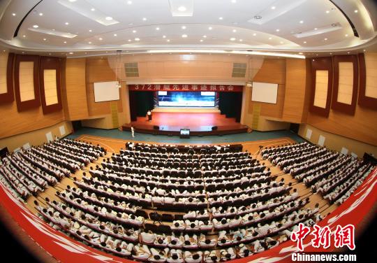 原文配图:报告会现场。 江晓卫 摄